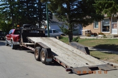 Touchdown Towing & Storage has a gooseneck flatbed trailer for jobs that require vehicle hauling